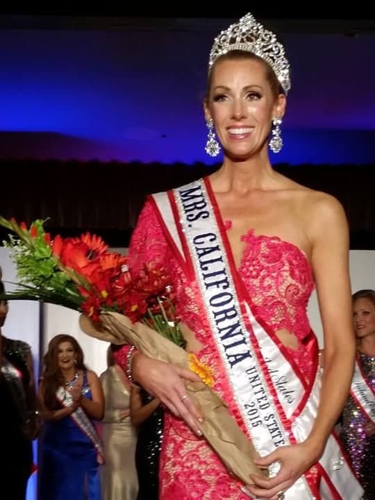 Rachel on stage with crown and flowers, moments after being named Mrs. California United States 2015